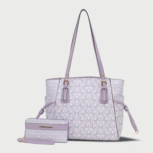 Lavender tote bag and matching wallet set featuring an allover monogram pattern and gold-tone hardware; the tote has side pockets and a long strap.