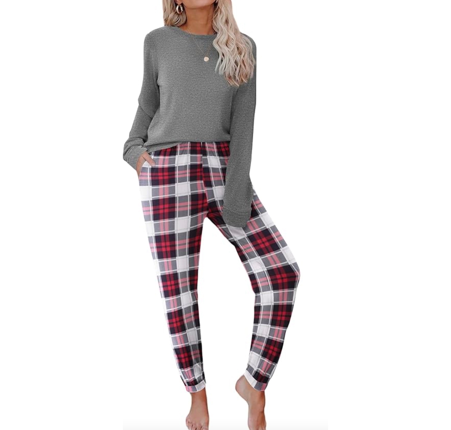 Women's pajamas feature a cozy grey long-sleeve top paired with red and white plaid pants. The pants include side pockets and are designed for comfort and casual wear.
