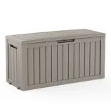 A taupe-colored outdoor storage box with a wood-look panel design, featuring a hinged lid and handle slots on the sides.