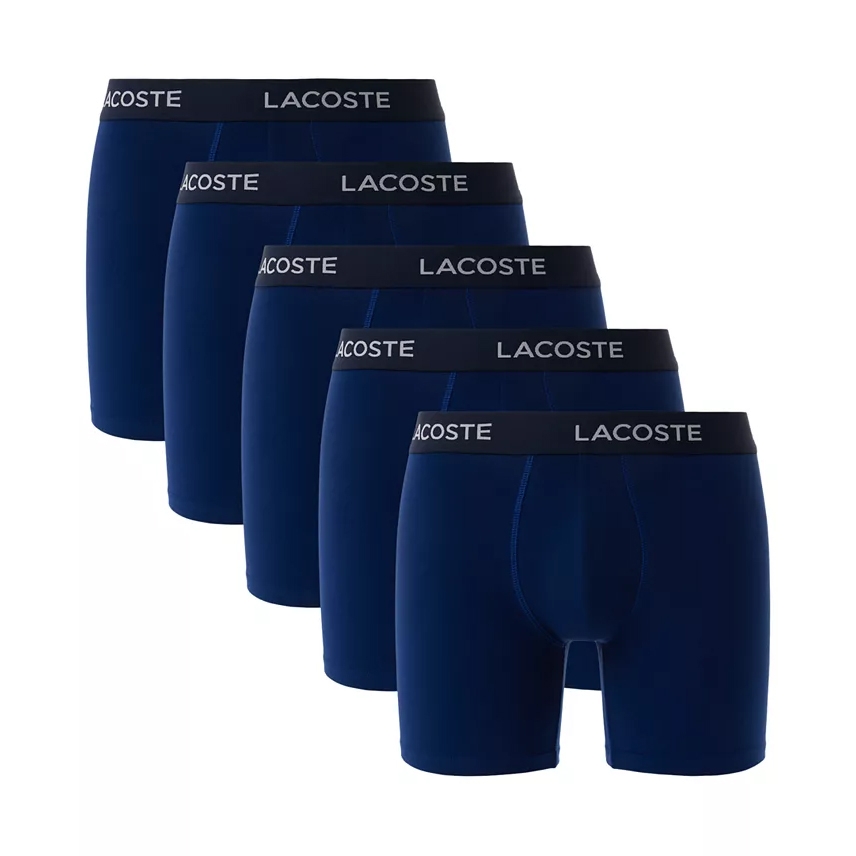 5pk Lacoste Boxer Briefs are navy blue with a black waistband featuring the \“Lacoste\“ logo in white. They are neatly arranged in a row, showcasing a seamless, snug-fitting design.