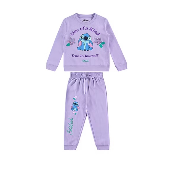 A purple children's tracksuit featuring a long-sleeve top and pants, adorned with a character graphic and phrases like \“One of a Kind\“ and \“True to Yourself\“ with the name \“Stitch\“ included.