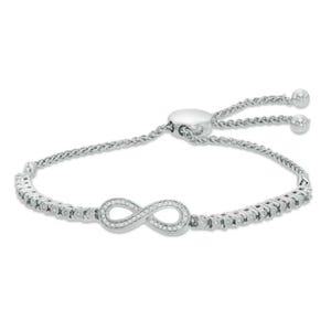 A silver-toned adjustable bracelet featuring an infinity symbol adorned with small clear stones, complemented by a chain and sliding closure with bead accents.