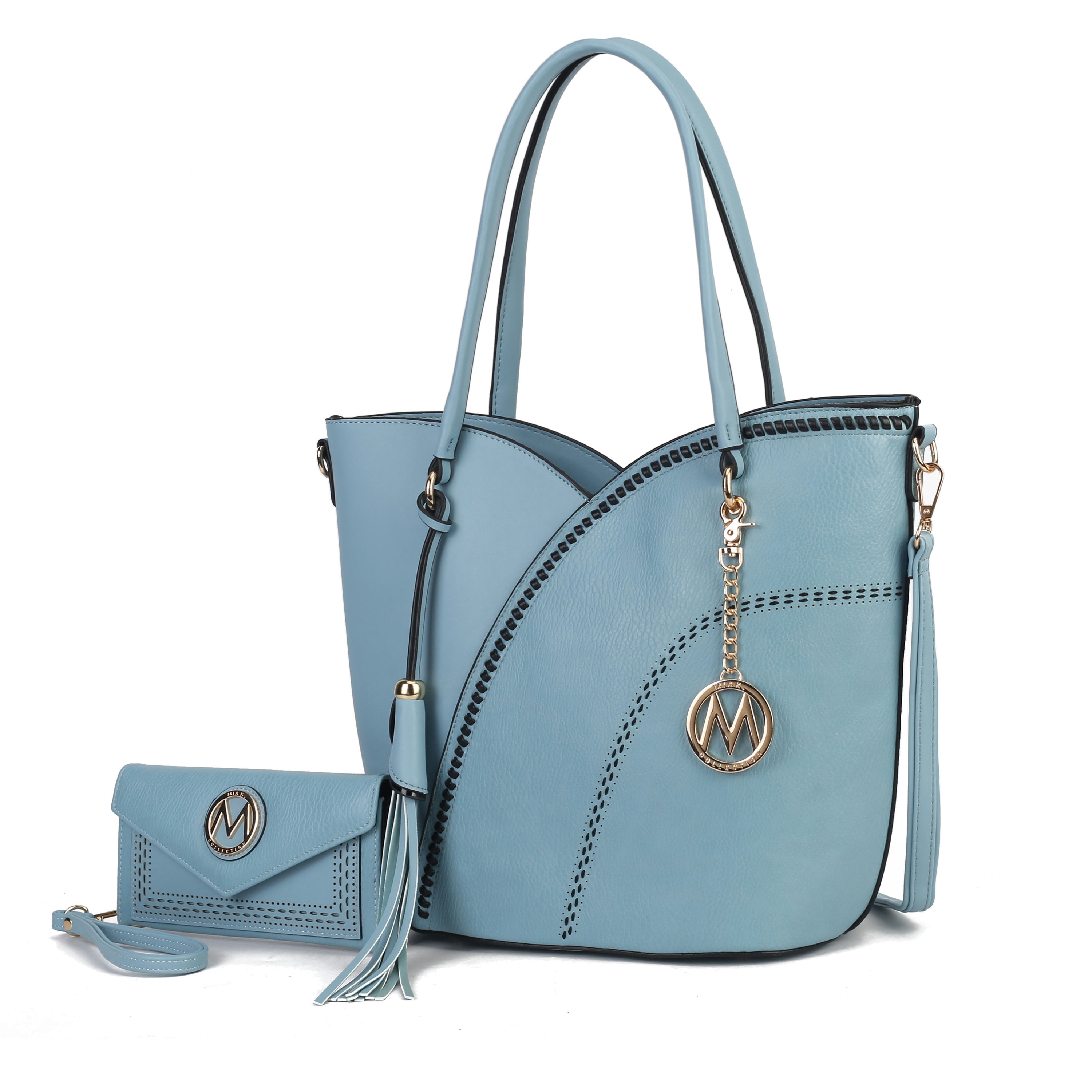 Light blue handbag and matching wallet with decorative stitching and gold accents, featuring a tassel and circular charm with an \“M\“ logo.
