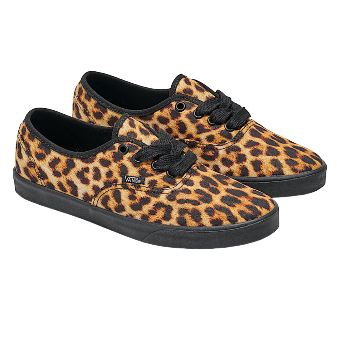 Vans sneakers with a leopard print design, featuring black laces and a black sole.