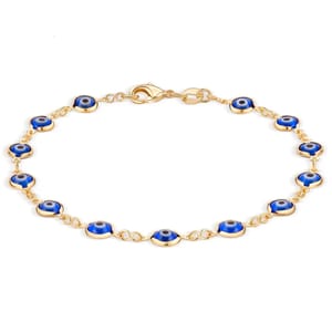 Gold bracelet featuring blue evil eye charms linked together.
