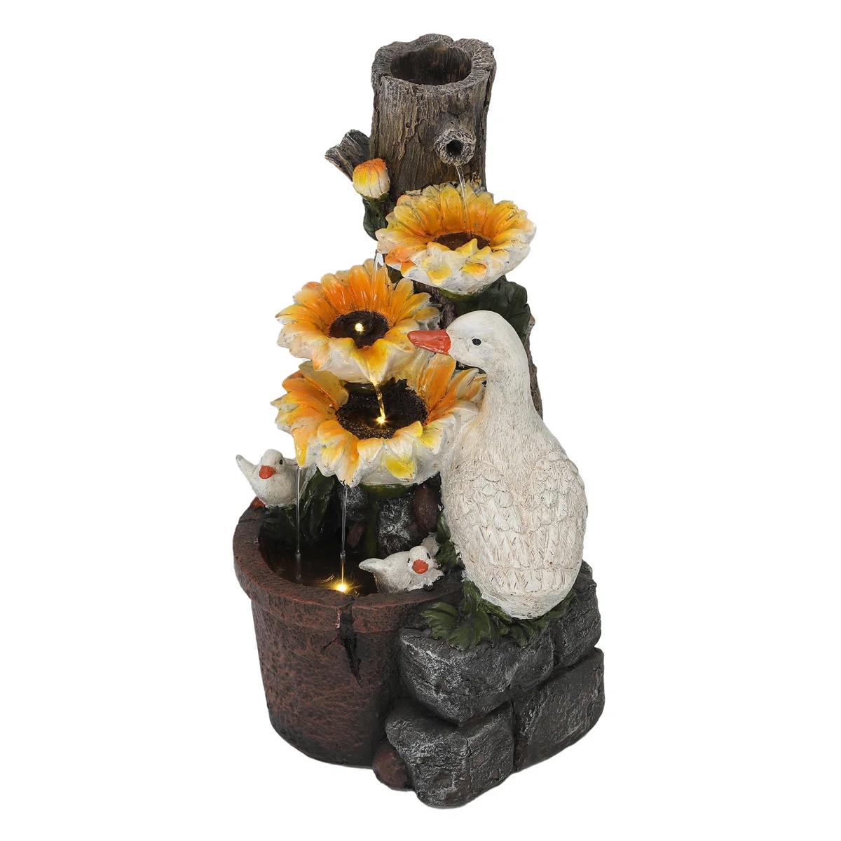 A decorative water fountain featuring a white duck and ducklings, surrounded by orange and yellow sunflower sculptures, with water flowing from the flowers.
