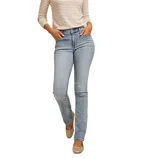 A person is wearing light-wash skinny jeans paired with a striped long-sleeve shirt and beige flats.