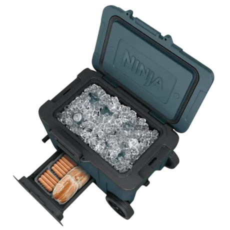 A wheeled cooler labeled \“Ninja\“ with its lid open, filled with ice and drinks, featuring a pull-out drawer containing hotdog buns and sausages.