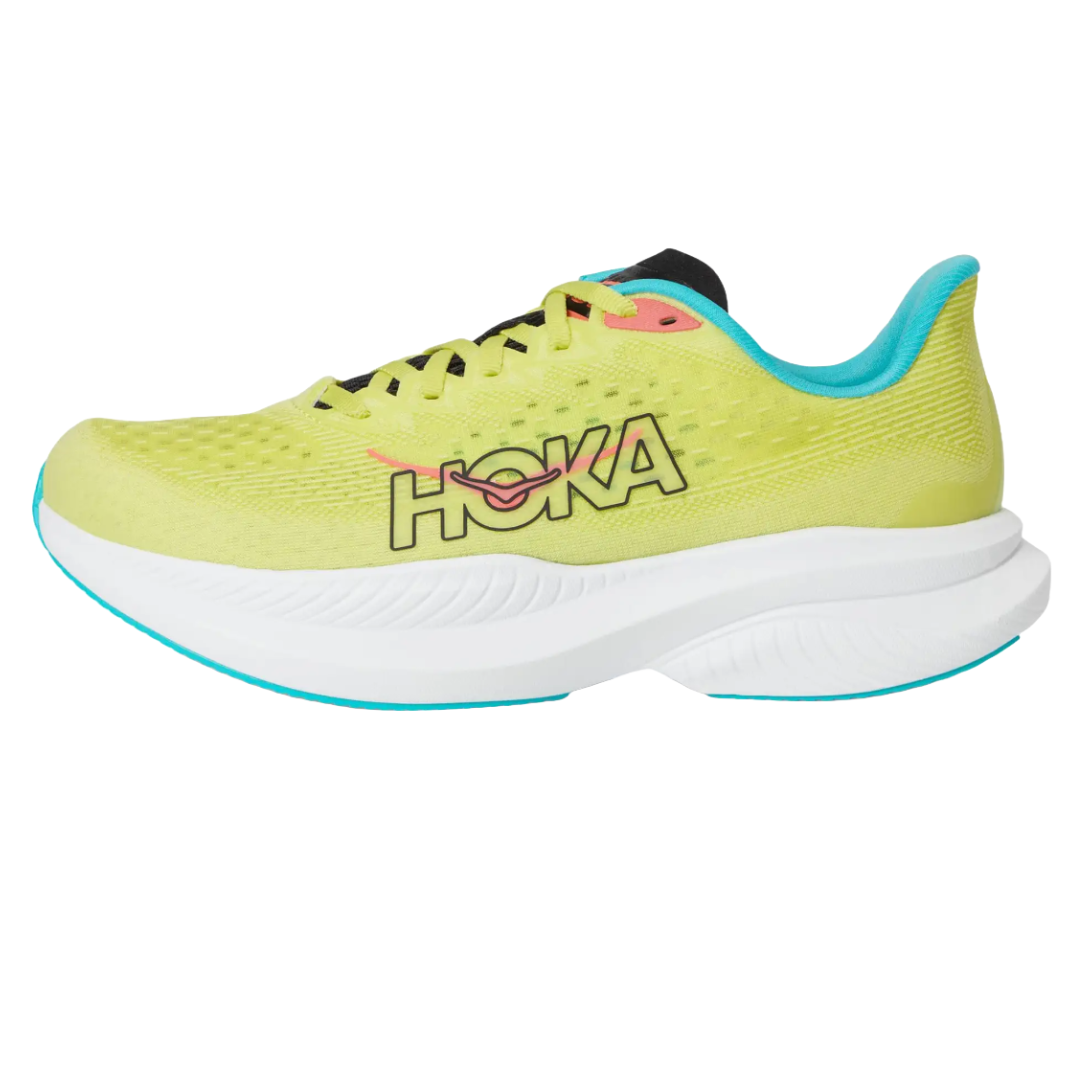 Hoka Women's Mach 6 Running Shoes feature a bright yellow mesh upper, turquoise inner lining, and a thick white cushioned sole, with the Hoka logo prominently displayed on the side. Designed for lightweight comfort and performance.