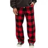 Red and black checkered pajama pants paired with black sneakers and a dark long-sleeve shirt.