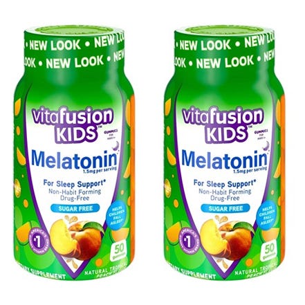 Two bottles of Vitafusion Kids Melatonin gummies for sleep support, sugar-free, with a natural tropical flavor.