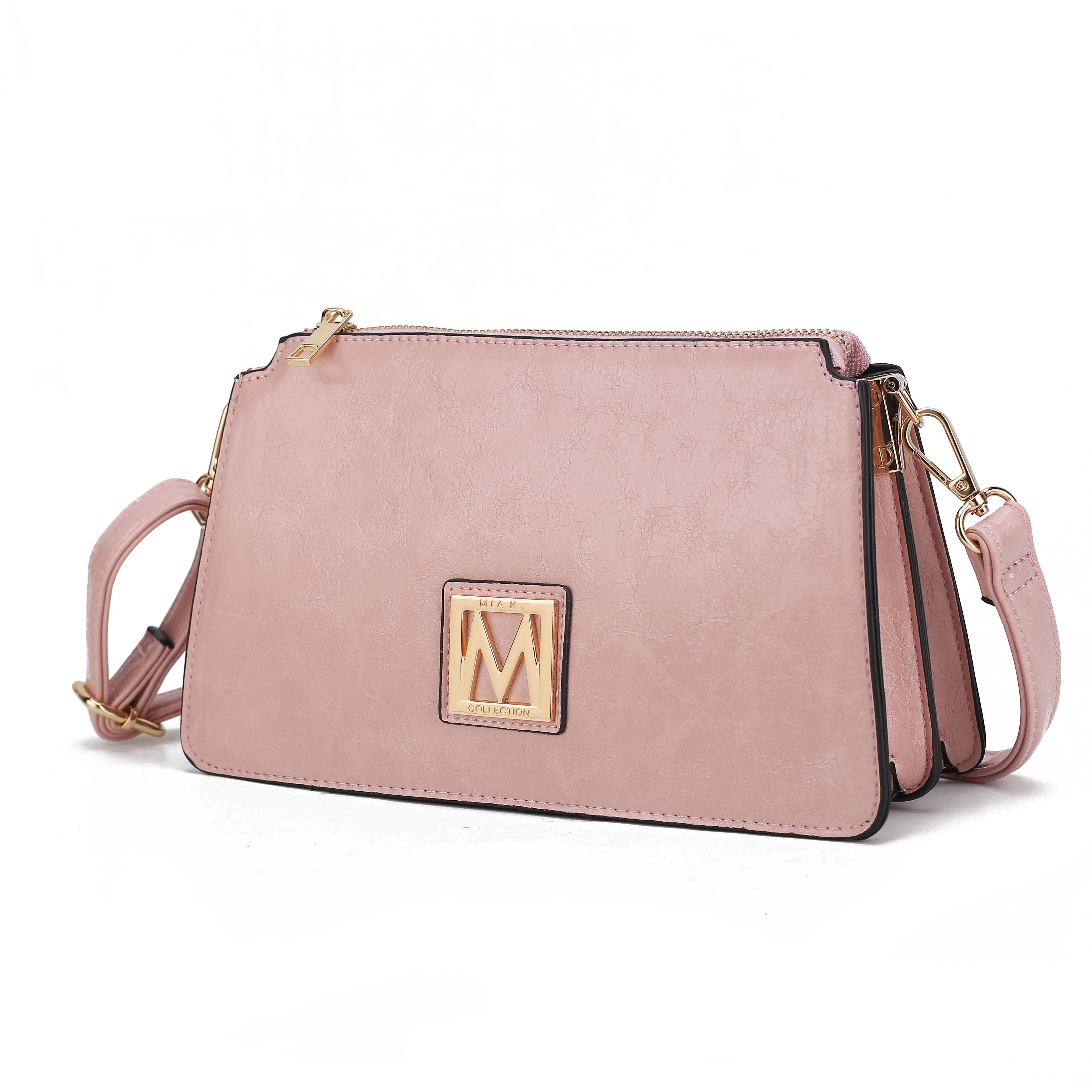 A pink handbag with a detachable strap and gold accents, featuring a prominent \“M\“ logo on the front.