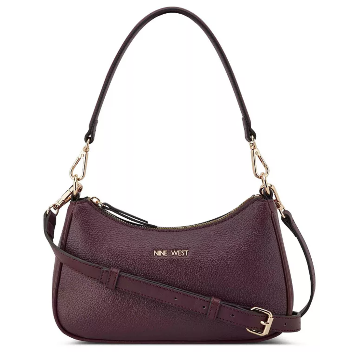 A Nine West handbag in dark purple with pebbled texture, featuring a zipper closure, gold-tone hardware, and detachable shoulder strap.