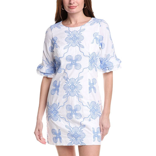 A white dress with blue floral patterns, featuring short ruffled sleeves and a round neckline.