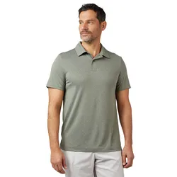 A man is wearing a gray-green short-sleeve polo shirt paired with light-colored pants.