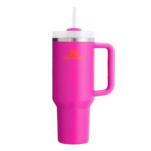 A pink insulated tumbler with a handle and a lid featuring a straw, designed to keep beverages hot or cold.