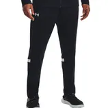 Black athletic track pants with the Under Armour logo on the upper left thigh, featuring white stripes above the knees, paired with black athletic shoes with white soles.