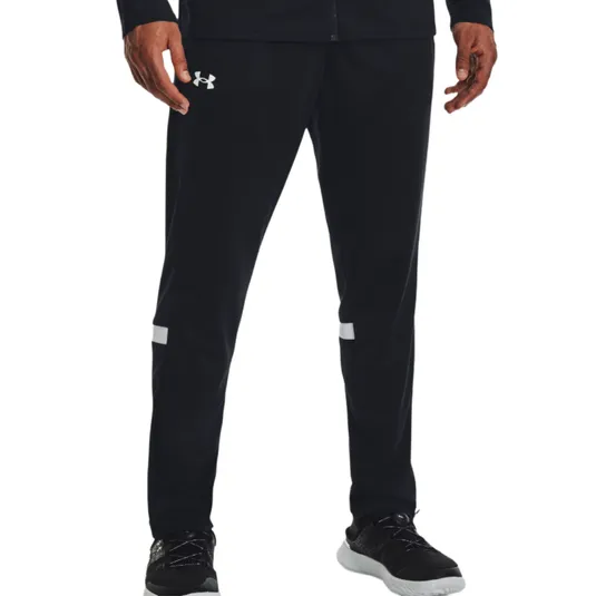 Black athletic track pants with the Under Armour logo on the upper left thigh, featuring white stripes above the knees, paired with black athletic shoes with white soles.