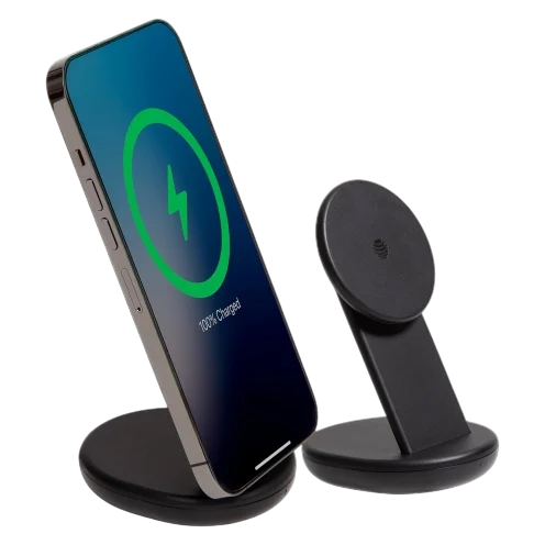 A wireless charging stand with a smartphone, showing it is 100% charged. The stand has a sleek, minimalist black design.