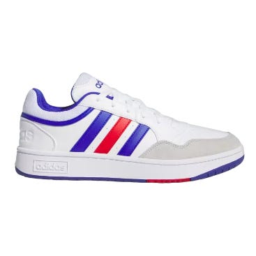 White sneaker with blue and red stripes on the side and a text logo on the heel.