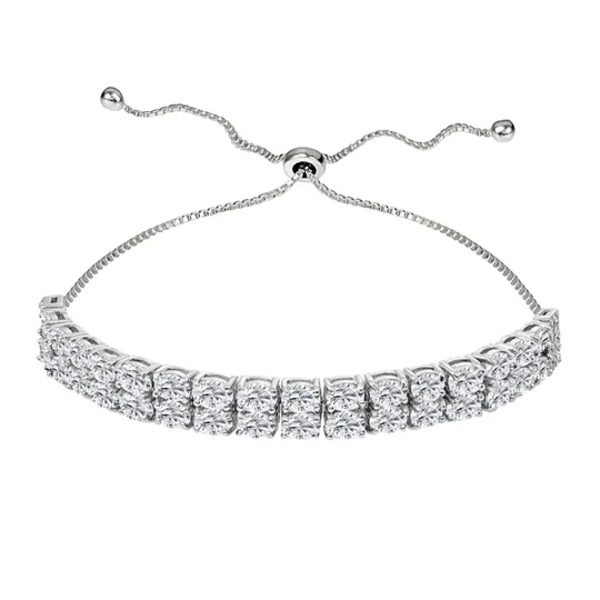 A silver adjustable bracelet featuring two rows of sparkling round-cut stones, secured with a sliding clasp for a customized fit.