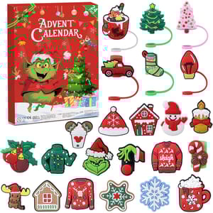 Advent calendar containing 24-piece Christmas-themed charms featuring festive designs like a green creature, Christmas tree, candy cane, snowman, sweater, and gingerbread house.