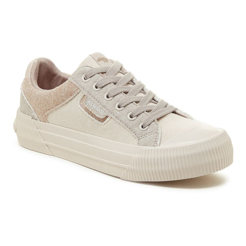 Casual sneaker featuring a beige and cream color scheme with canvas and suede textures, complemented by a vulcanized rubber sole and tonal laces.