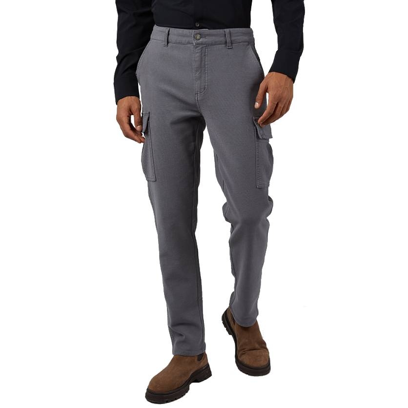 Gray stretch cargo pants with side pockets, a button and zipper closure, and belt loops. Worn with a dark shirt and brown suede boots.