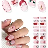 Nail wrap stickers with festive holiday designs including snowflakes, bows, holly, and candy canes in red, pink, and white colors.