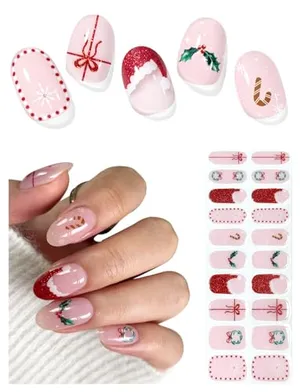 Nail wrap stickers with festive holiday designs including snowflakes, bows, holly, and candy canes in red, pink, and white colors.