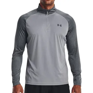 A gray and black long-sleeve athletic shirt with a quarter-zip and the Under Armour logo on the chest.