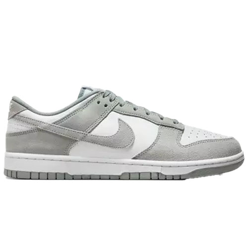 A pair of gray and white low-top sneakers with suede and leather details, featuring the Nike logo on the sides.