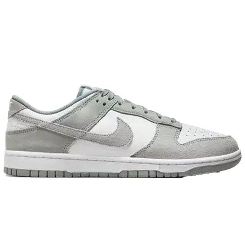 A pair of gray and white low-top sneakers with suede and leather details, featuring the Nike logo on the sides.