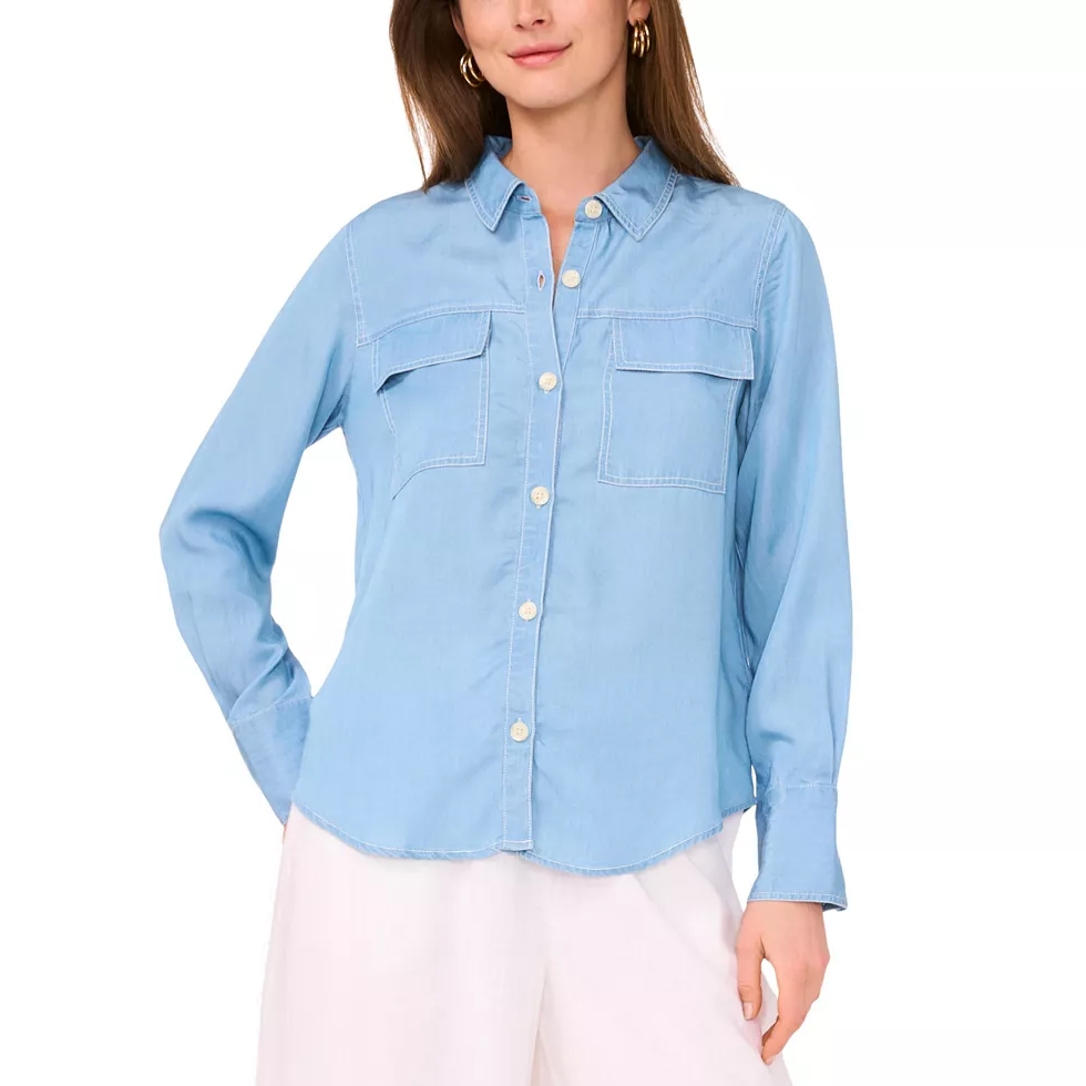 Light blue long-sleeve button-up shirt with two front pockets, paired with white pants.