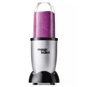Magic Bullet Personal Blender with a silver base and blend cup filled with a purple smoothie. Designed for quick blending of smoothies and other drinks.