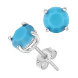 Blue gemstone stud earrings with a round cut, set in a prong setting on silver posts with butterfly backs.
