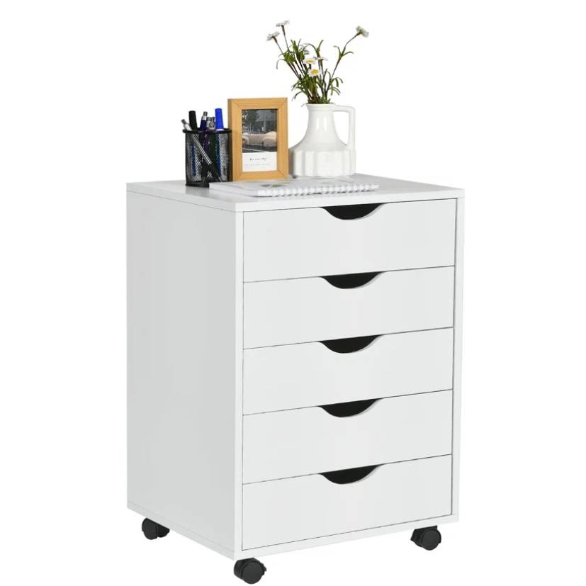 White drawer unit on wheels with five drawers, featuring a vase with flowers, a framed photo, and a pen holder on top.