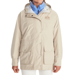 A beige Marmot '78 All-Weather Parka featuring a hood, button closure, two large front pockets, and an embroidered logo on the chest, layered over a blue jacket.