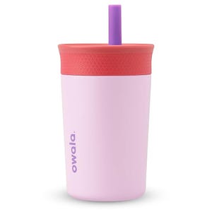 A pink insulated tumbler with a red textured lid and purple straw, branded \“owala.\“