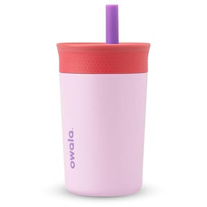 A pink insulated tumbler with a red textured lid and purple straw, branded \“owala.\“