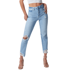 Light blue distressed jeans with rips at the knees and hem, paired with strappy heels and a white cropped top.