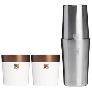 Stanley 3pc Cocktail Set includes two white and copper-colored cups and a stainless steel shaker, all featuring Stanley's logo.