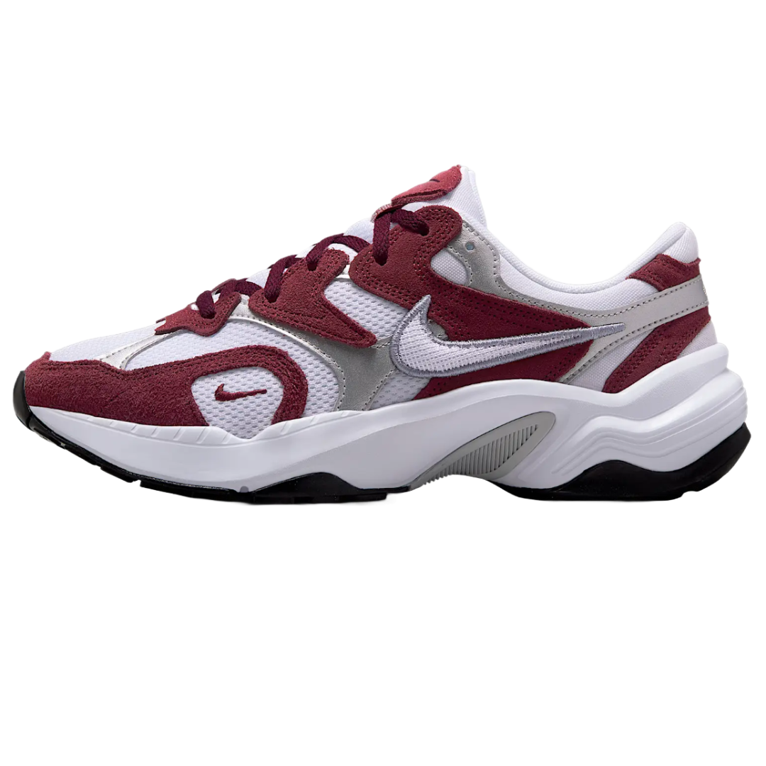 Nike Women's AL8 Shoes feature a sleek design with maroon suede overlays and white mesh, accented by a silver swoosh. The sole is white with black details, offering a stylish and athletic look.