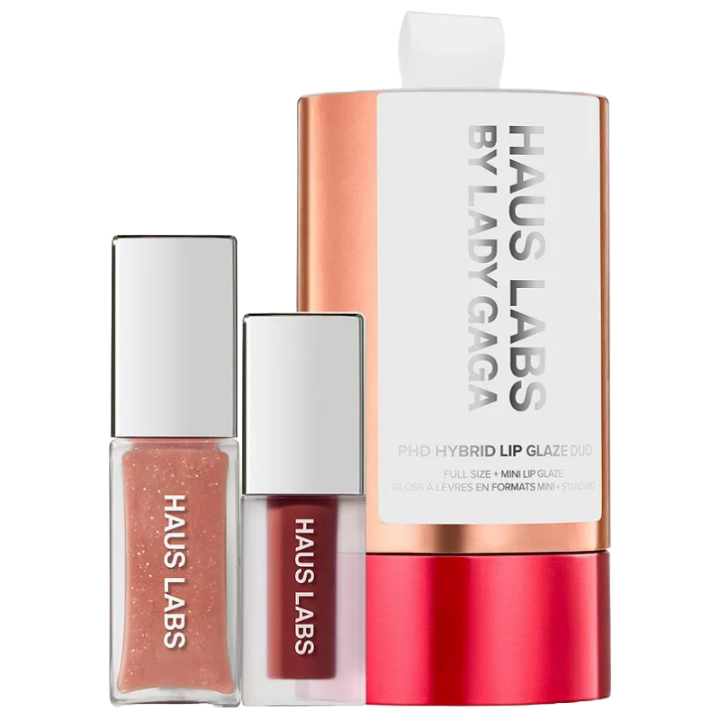 Haus Labs Plumping Lip Glaze Set includes a full-size and mini lip glaze in a copper and white packaging, featuring products with a glossy finish and possibly a shimmery and a tinted option.