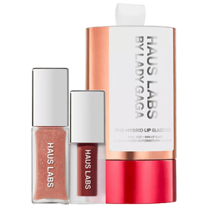 Haus Labs Plumping Lip Glaze Set includes a full-size and mini lip glaze in a copper and white packaging, featuring products with a glossy finish and possibly a shimmery and a tinted option.