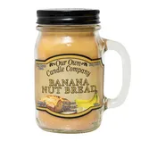 Our Own Candle Company Banana Nut Bread scented candle in a mason jar with a handle, featuring notes of walnut, banana, and nutmeg.