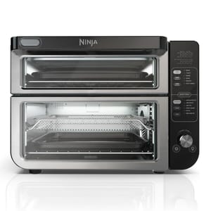 A dual-compartment Ninja countertop oven with digital controls and smart preset functions for cooking flexibility, featuring separate top and bottom oven compartments for simultaneous baking and air frying.
