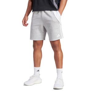 Gray athletic shorts with a logo on the lower left, paired with white sneakers and socks.