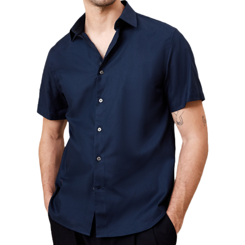 A navy blue short-sleeve dress shirt with a pointed collar and front button closure is shown, worn by a male model.