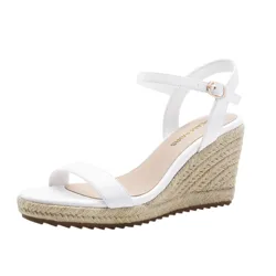 White wedge sandal with a braided jute platform and an ankle strap buckle.
